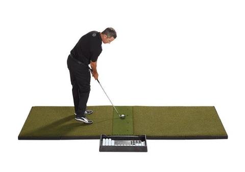 Golfer hitting from a Fiberbuilt Grass Series studio mat