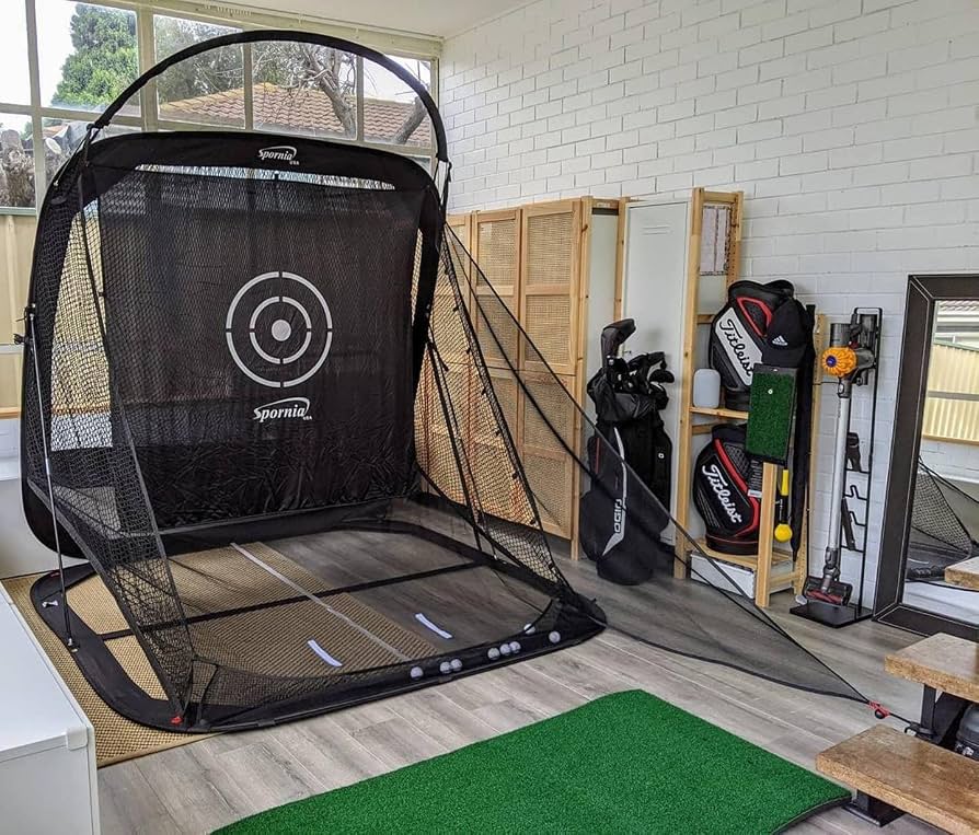 Spornia SPG-7 golf practice net set up indoors with a hitting mat